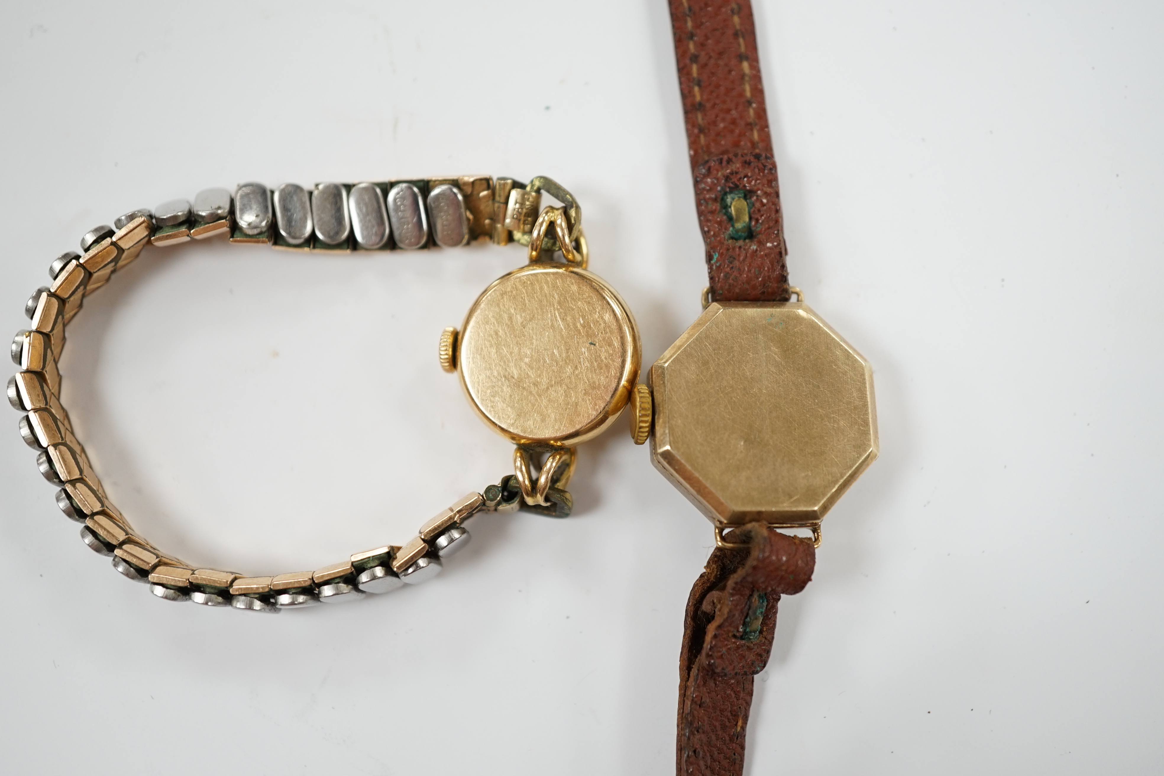 A lady's 18k Longines manual wind wrist watch, on a gold plated flexible bracelet, together with a lady's 9ct gold Omer manual wind wrist watch, on a leather strap.